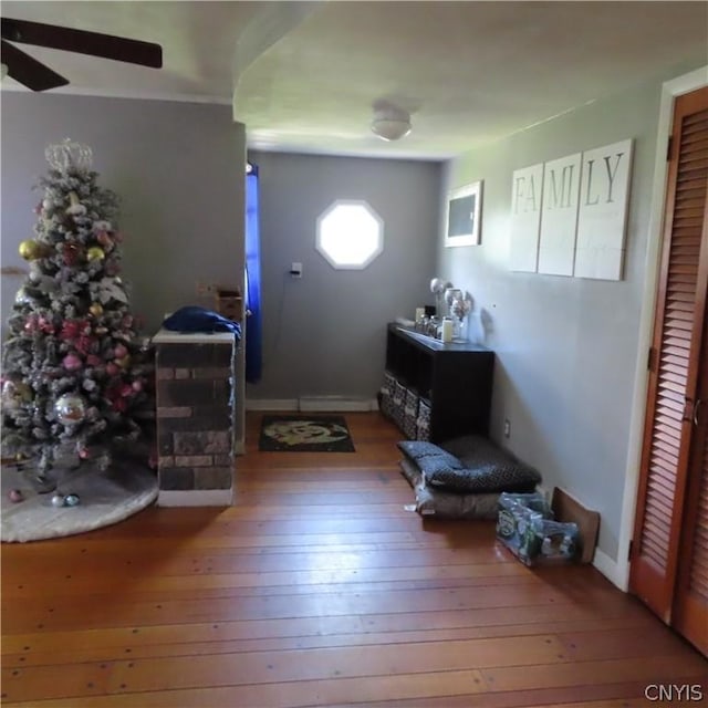 foyer entrance featuring hardwood / wood-style floors and ceiling fan