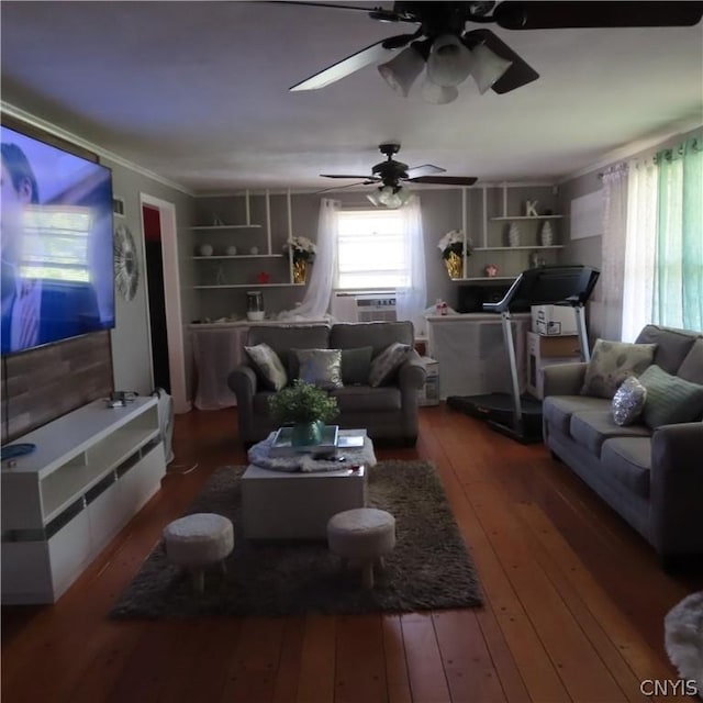 living room with built in shelves and wood-type flooring