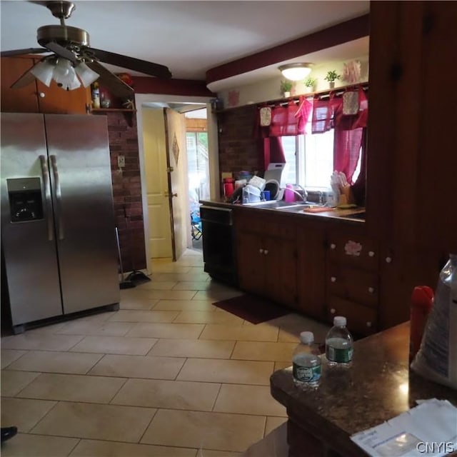 kitchen with stainless steel fridge, sink, ceiling fan, and dark brown cabinets