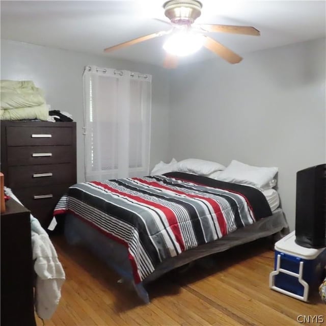 bedroom featuring ceiling fan and light hardwood / wood-style floors