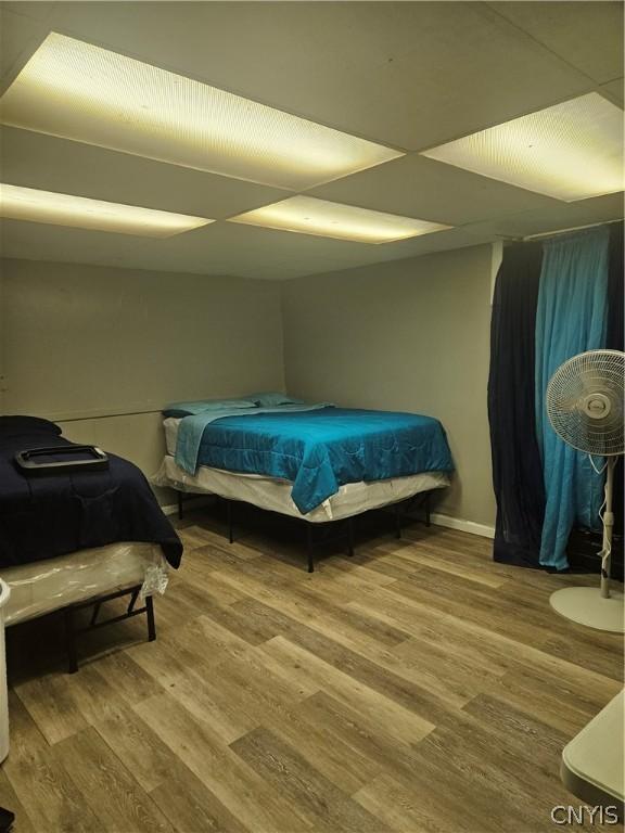 bedroom with wood-type flooring