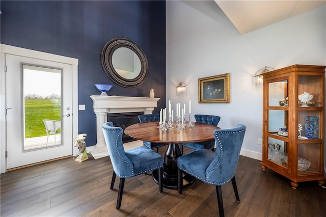 dining space featuring dark wood-type flooring