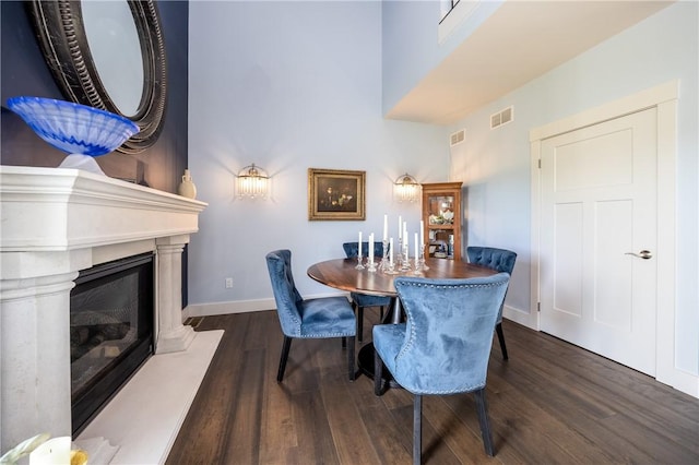 dining space featuring dark wood-type flooring