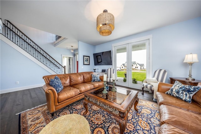 living room with french doors and hardwood / wood-style flooring