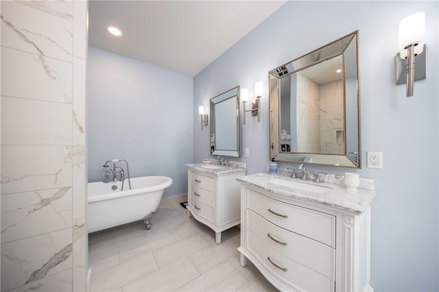 bathroom with vanity and a bath