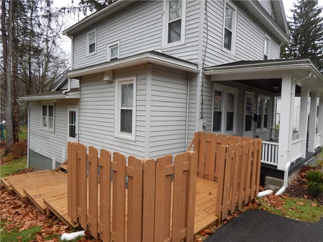 view of property exterior with a porch