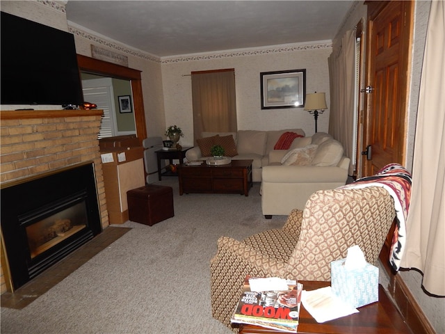 carpeted living room featuring a brick fireplace and crown molding