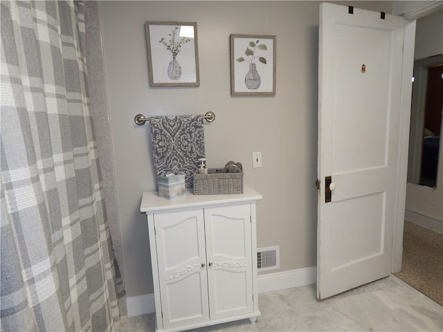 bathroom featuring tile floors and vanity