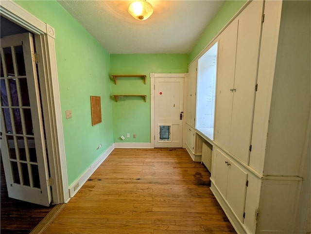 washroom with light wood-type flooring