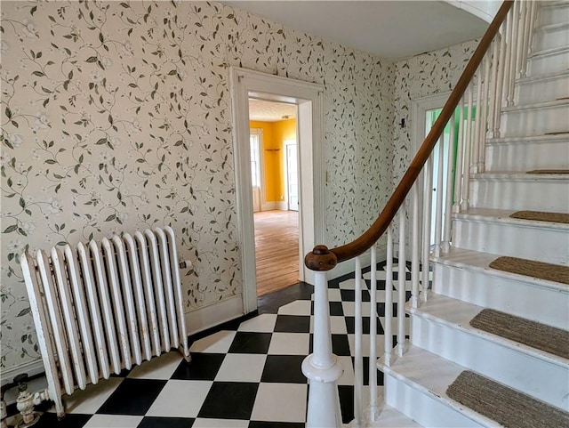 stairs featuring radiator heating unit