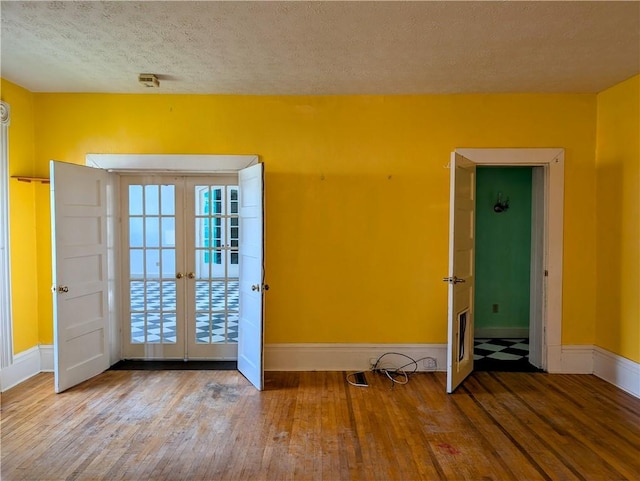 entryway featuring hardwood / wood-style floors and a textured ceiling