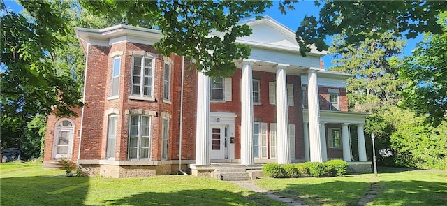 neoclassical / greek revival house with a front yard