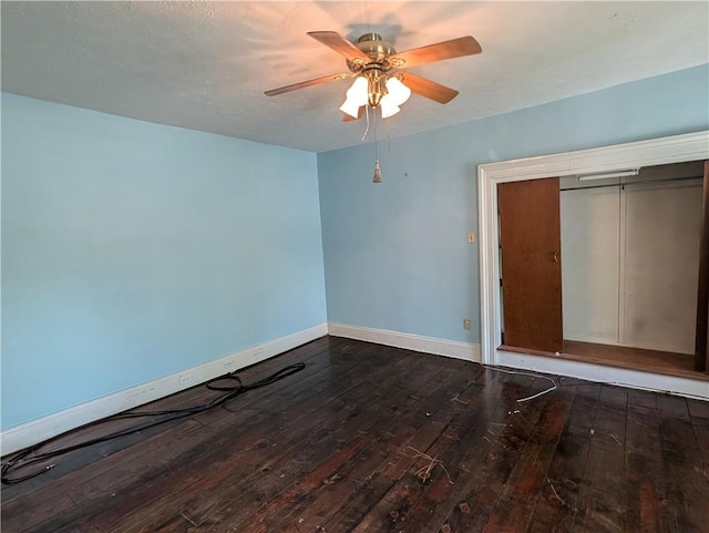 unfurnished bedroom with a closet, ceiling fan, and hardwood / wood-style floors