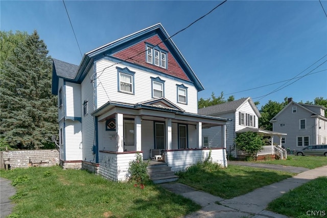 view of front of house featuring a porch and a front lawn