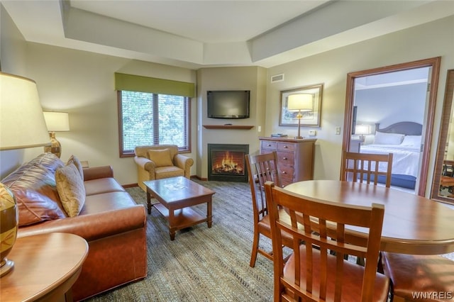 living room with a tray ceiling