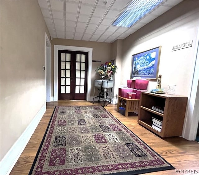 entryway with french doors and hardwood / wood-style flooring