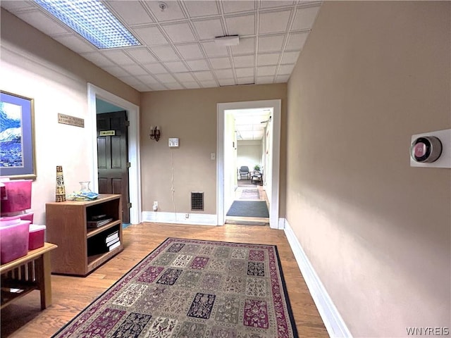 corridor featuring light hardwood / wood-style floors