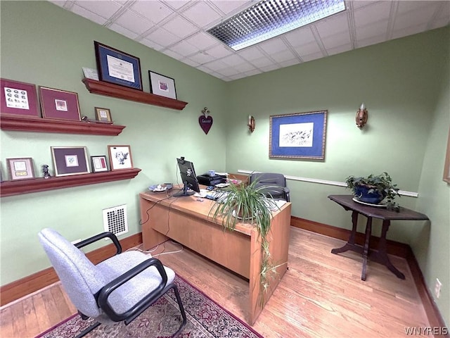 office with light hardwood / wood-style floors