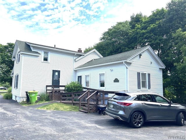 view of front of property with a wooden deck