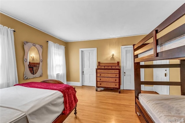 bedroom with light hardwood / wood-style floors