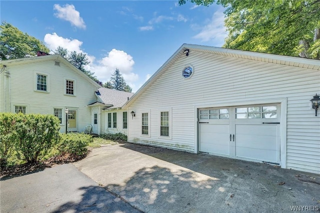 back of house with a garage