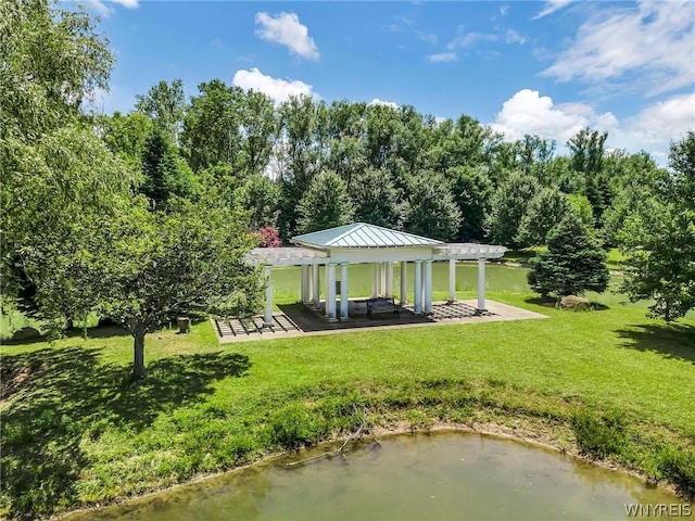 surrounding community with a pergola, a water view, and a gazebo