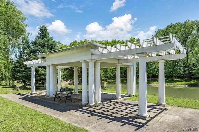 view of property's community featuring a pergola, a gazebo, a patio, and a water view