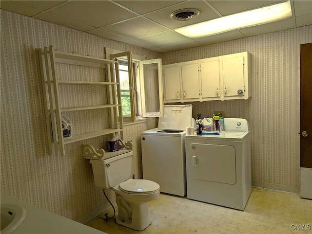 clothes washing area with washing machine and clothes dryer