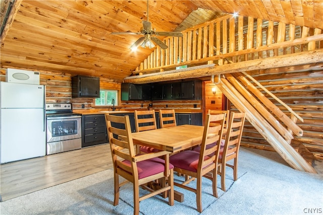 dining room with vaulted ceiling, wood ceiling, sink, rustic walls, and light wood-type flooring