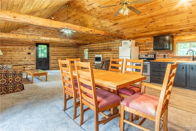 dining space with light carpet, ceiling fan, rustic walls, and wood ceiling