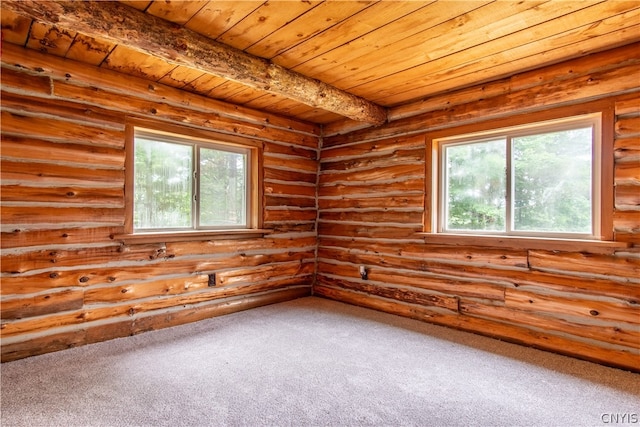 carpeted spare room featuring beamed ceiling, wooden ceiling, and rustic walls