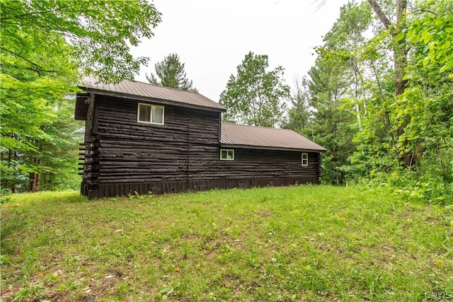 view of home's exterior featuring a yard