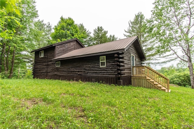 view of side of property with a yard