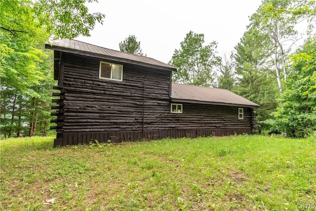 view of home's exterior featuring a lawn