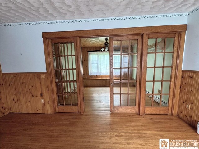 doorway featuring ceiling fan and light wood-type flooring