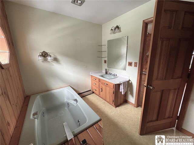 bathroom featuring baseboard heating, wooden walls, vanity, and a bath