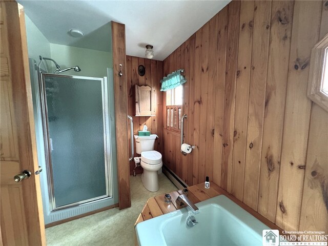 bathroom with plus walk in shower, toilet, wooden walls, and a baseboard radiator