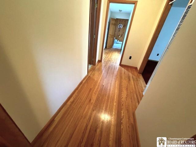 corridor featuring light wood-type flooring