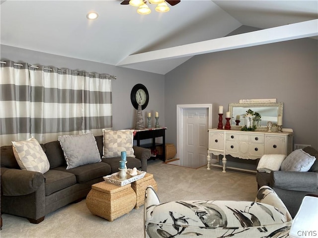 carpeted living room featuring ceiling fan and lofted ceiling