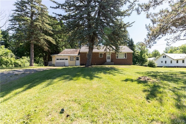 ranch-style home with an outbuilding and a front lawn