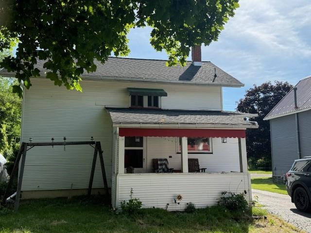 view of front of house with a chimney