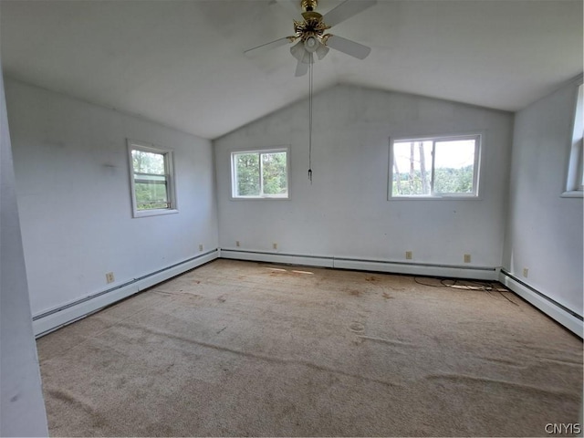 carpeted spare room featuring ceiling fan, lofted ceiling, and a baseboard heating unit