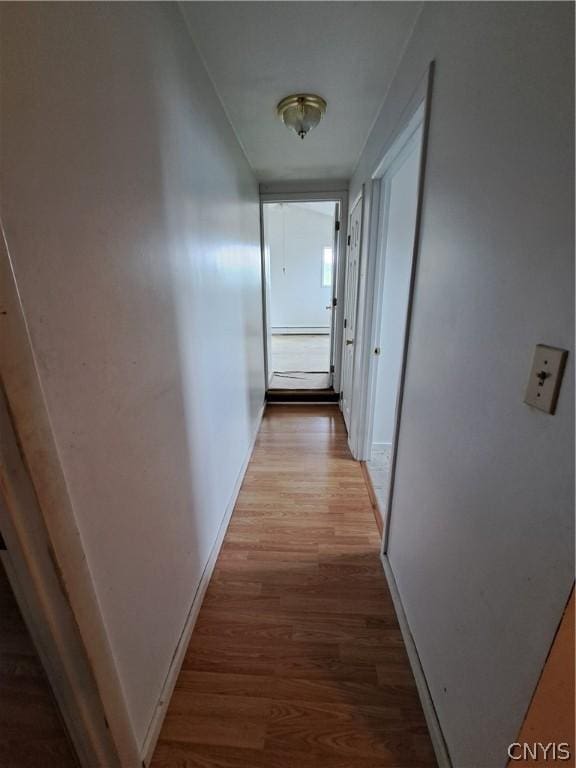 hallway with wood-type flooring