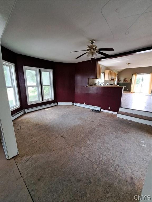 unfurnished living room featuring baseboard heating and ceiling fan