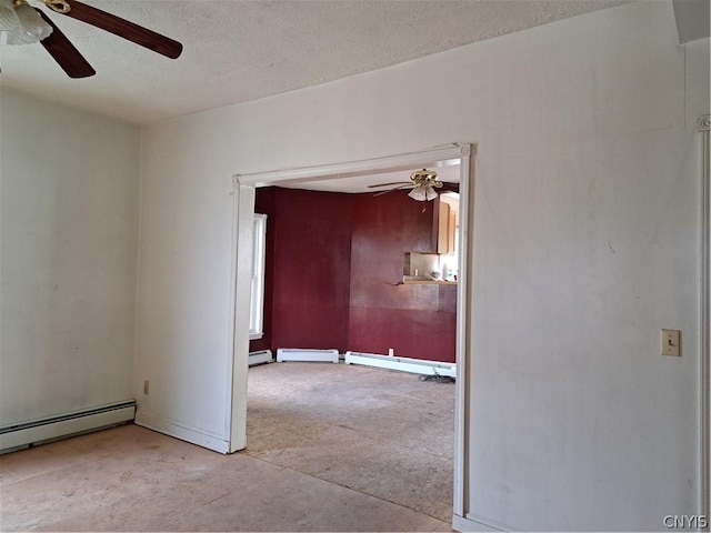 empty room featuring ceiling fan, a textured ceiling, and a baseboard heating unit