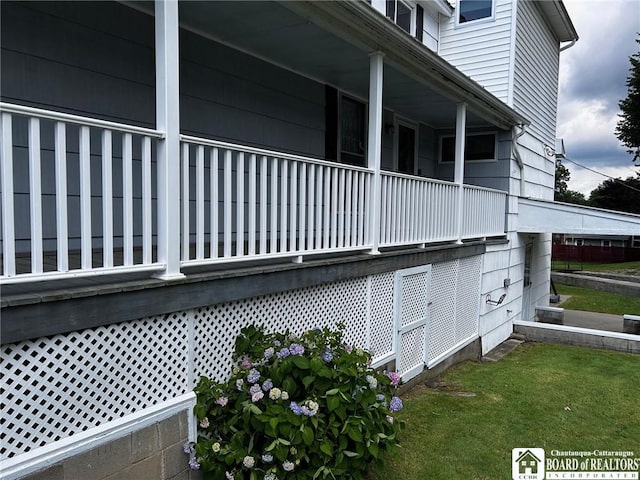 view of side of property with a yard