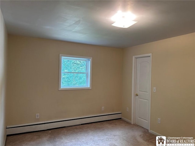 carpeted empty room with baseboard heating