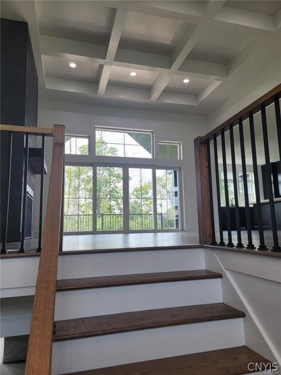 stairs with beam ceiling and coffered ceiling