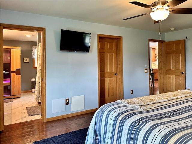 bedroom featuring wood-type flooring and ceiling fan