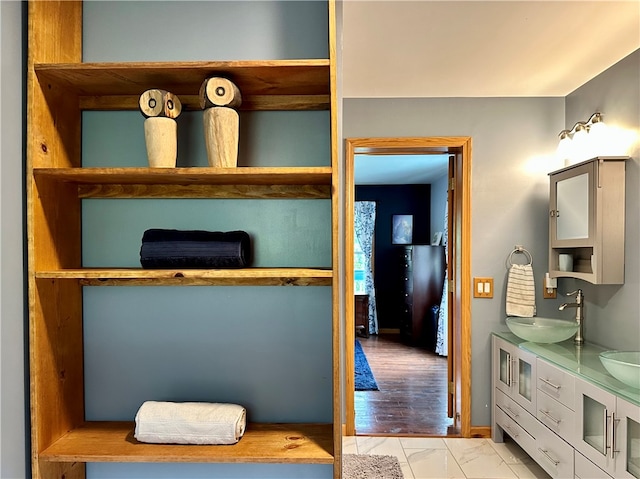 interior space with vanity and hardwood / wood-style flooring